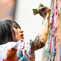 Contemporary artist Miwa Komatsu creates a new work during a live painting performance at the Cleveland Museum of Art on May 11 as part of the museum’s “Shinto: Discovery of the Divine in Japanese Art” exhibition, open through June 30.