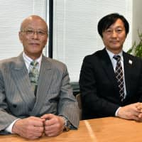 Apure Inc. President Hirosuke Takahashi (left) and NTT Docomo's Corporate Sales and Marketing Department Executive Director Masamichi Endou during an interview with The Japan Times in Tokyo on Jan. 18.