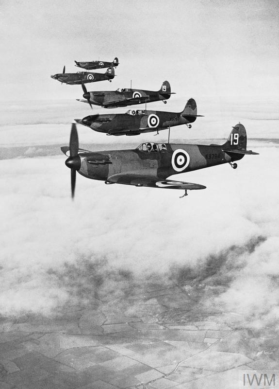 Six Spitfire Mark Is flying in starboard echelon formation