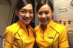 Nok Air's all-female crew wear sunny yellow uniforms.