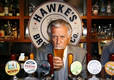 Bob Hawke drinks his own beer at the launch of Hawke's Lager in 2017.