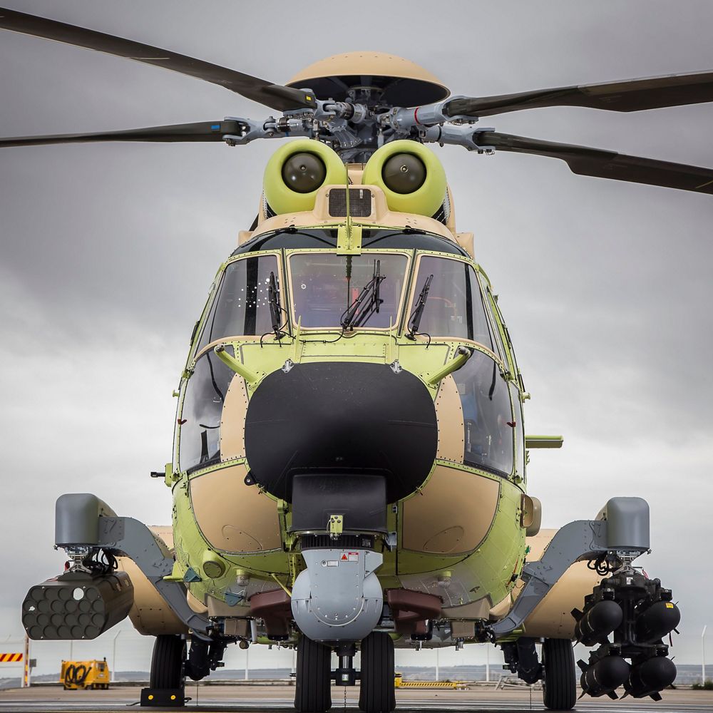 A head-on view of an on-ground NH90 military helicopter configured with Airbus’ HForce onboard weapon system. 