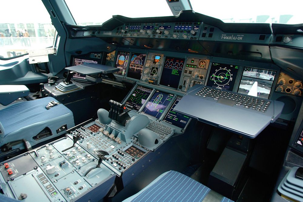 A close-up view of the A380 flight deck, including the fly-by-wire flight controls and interactive cockpit displays