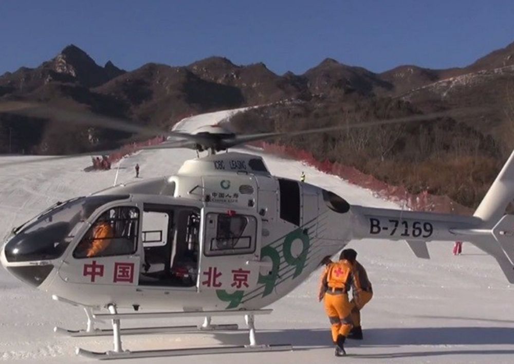 An Airbus H135 helicopter operated by the Chinese Ministry of Public Security shown on snow-covered ground. 