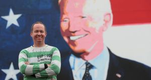 Joe Blewitt, a  cousin of US presidential candidate Joe Biden at a mural in his ancestral home of Ballina: “He’s flying now.” Photograph: Brian Lawless/PA
