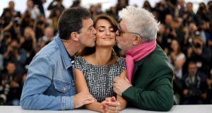 Cannes 2019: Antonio Banderas and Pedro Almodvar kiss Penlope Cruz at a Pain and Glory photocall. Photograph: Lo?c Venance/AFP/Getty