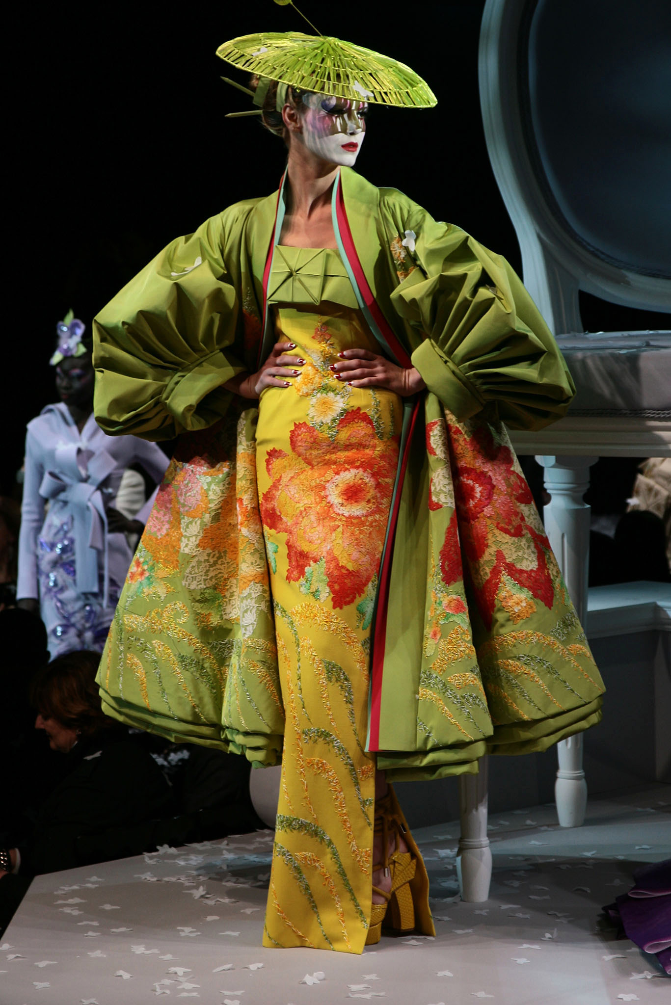 A model poses in an ensemble from Dior's "Madame Butterfly" collection designed by John Galliano at the Polo de Paris.