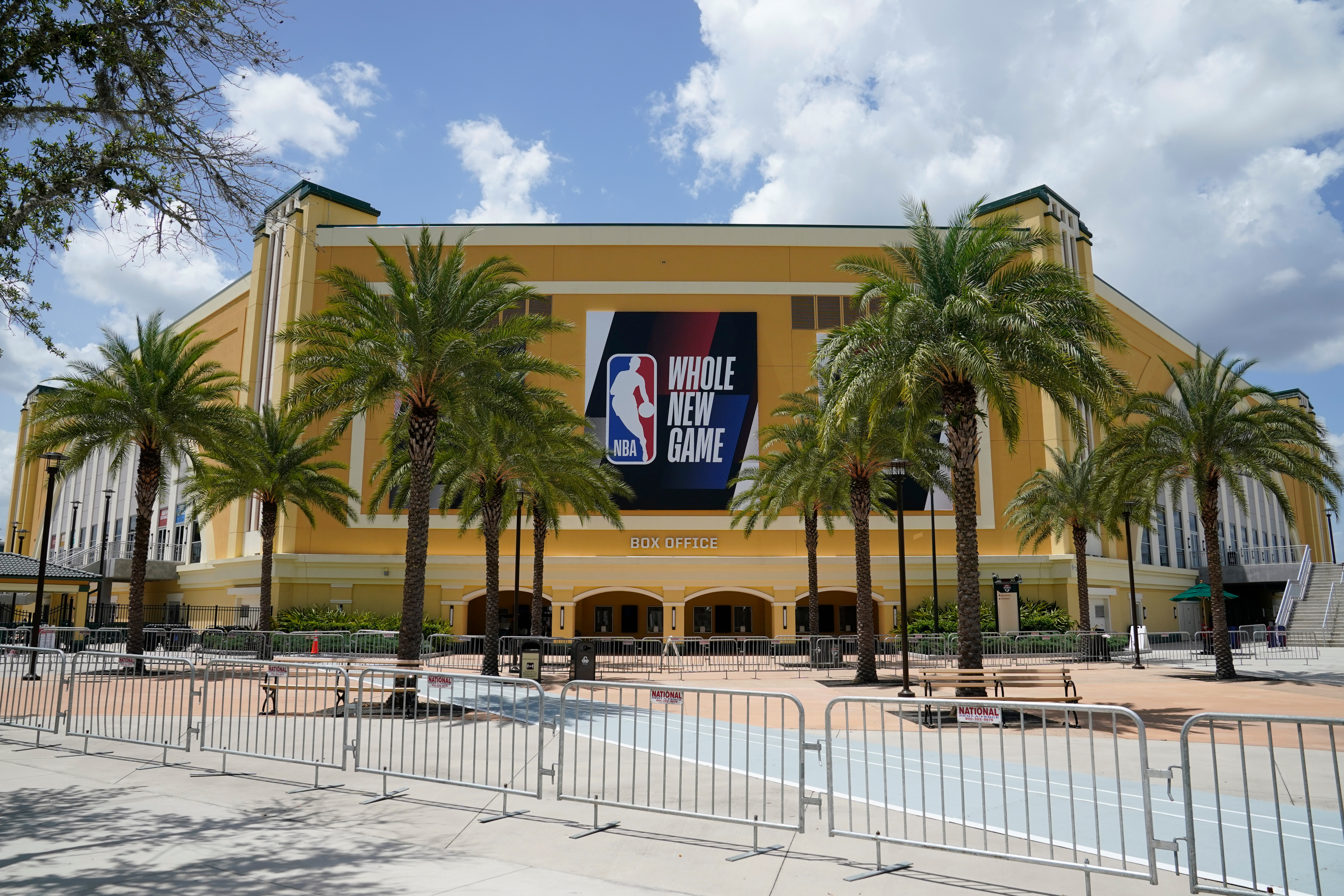 An NBA sign is posted on a basketball arena at ESPN Wide World of Sports Complex in Orlando, Fla., where NBA games resumed July 30.