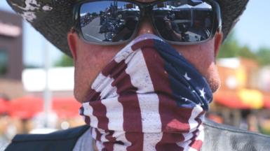 Man with USA flag face covering