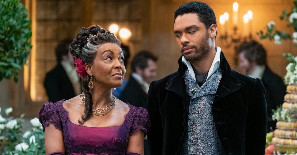 ADJOA ANDOH as LADY DANBURY and REGÉ-JEAN PAGE as SIMON BASSET