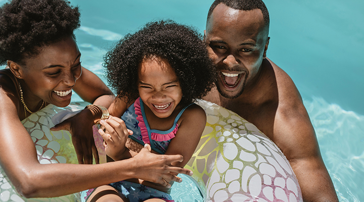 family having fun in pool