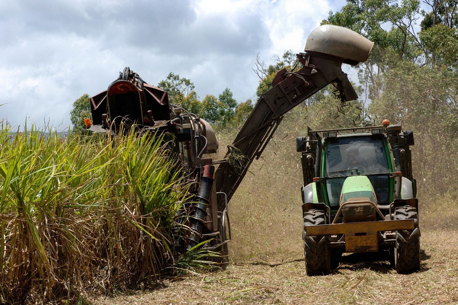 Image of tractor farming crops.