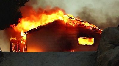 A building consumed by fire in southern California