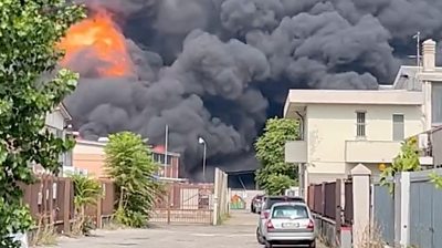 Fire comes through black smoke