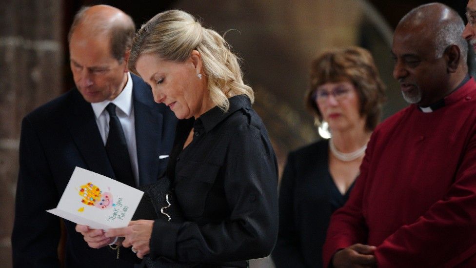 The Earl and Countess of Wessex reading a condolence card at Manchester Cathedral