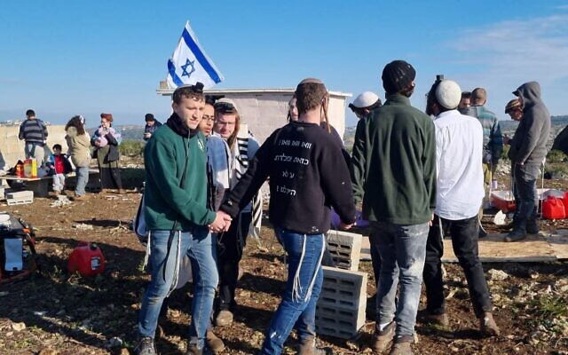 Settler activists dance in celebration at the establishment of the illegal settlement outpost of Gofna on Sunday morning, February 12, 2023, before it was evacuated and demolished by personnel from the Border Police and Civil Administration. (Courtesy)