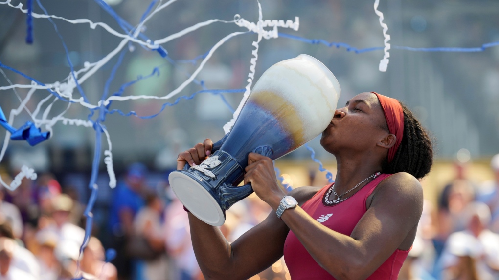 Coco Gauff, of the United States, kisses the Rookwood Cup after defeating Karolina Muchova, of the Czech Republic, in the women's singles final of the Western & Southern Open tennis tournament, Sunday, Aug. 20, 2023, in Mason, Ohio. (AP Photo/Aaron Doster)