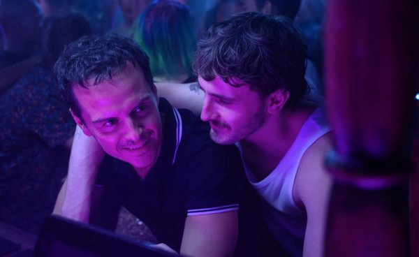 Still image from All of Us Strangers showing two men at a bar, one with an arm around the other