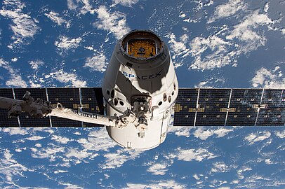 Dragon grappled by the ISS