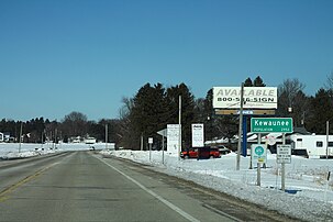 Sign at the city limits at the south of the city along Highway 42