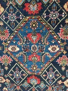 Section (central medallion) of a South Persian rug, probably Qashqai, late 19th century, showing irregular blue colours (abrash)