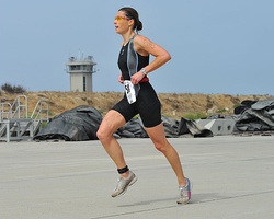 A U.S. Army soldier wearing sportswear runs to maintain his fitness.