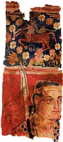 The Sampul tapestry, a woollen wall hanging from Lop County, Hotan Prefecture, Xinjiang, China, showing a possibly Greek soldier from the Greco-Bactrian kingdom (250–125 BC), with blue eyes, wielding a spear, and wearing what appears to be a diadem headband; depicted above him is a centaur, from Greek mythology, a common motif in Hellenistic art;[112] Xinjiang Region Museum.