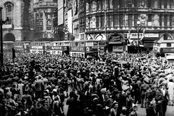 Crowds gathering in celebration at Piccadilly Circus, London during VE Day on 8 May 1945