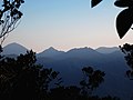 View of Mts.Yong Yap (left), Bubu (middle) and Tok Nenek (right, with a characteristic col) from the northern side of Mount Yong Belar