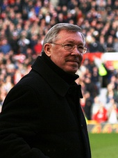 Alex Ferguson standing inside a stadium