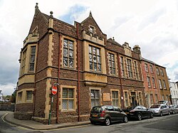 Three-storey red stone building