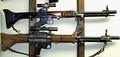 The FG 42 battle rifle/automatic rifle was one of the first inline fire arms incorporating a "straight-line" recoil configuration to reduce muzzle rise.