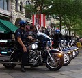 Denver Police patrol the "LoDo" (Lower Downtown) district during the convention