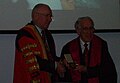 Graeme Clark (right) receiving the 2010 Lister Medal