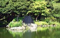 A large flat rock on an island in Korakuen garden in Tokyo, which represents a turtle's head