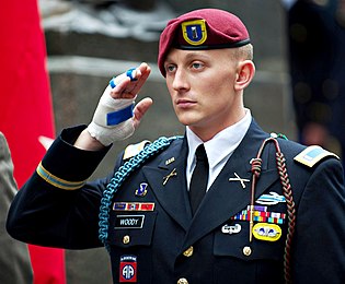 Then Captain Dan McKinney with the US Army Infantry School's Airborne Department wearing maroon beret with his Parachutist Badge and background trimming above his rank insignia, c. 1973