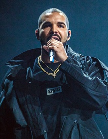 Drake holding a microphone and facing forwards