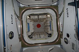 View of HTV-1 through the CBM port. 'MPLM' on the harmony module refers to a cargo container which uses the same berth.