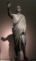 The Orator, c. 100 BC, an Etrusco-Roman bronze statue depicting Aule Metele (Latin: Aulus Metellus), an Etruscan man wearing a Roman toga while engaged in rhetoric; the statue features an inscription in the Etruscan alphabet