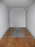 The typical gooseneck tunnel is clearly visible in the underside of a toppled-over, long container (first picture), as well as in a container's interior, where it takes the space otherwise covered by wood flooring. Gooseneck container trailer showing twistlock couplings for forty-foot boxes at its four corners. Twenty foot containers, on the other hand, frequently have forklift pockets, accessible from the sides (last picture).[nb 9]