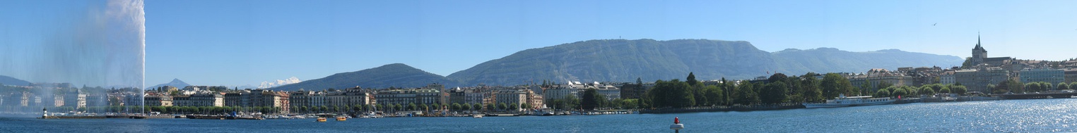  View of Geneva to the south. Mont Salève (in France) looms large behind the city, with the white summit of Mont Blanc just visible behind it 70 km (43 mi) away to the southeast. To the left of Mont Blanc is the point of Le Môle, with the Jet d'Eau in the foreground.