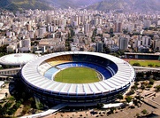 Original configuration of the Maracanã from 1950 to 2010, featuring a two-tier bowl and solid-color seating. (left: Exterior view, 2009. right: interior view looking towards the southern end, 2007.)