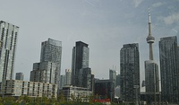 The railway lands were redeveloped in the early 21st century, with its western portion becoming the neighbourhood of CityPlace (left) and its eastern portion South Core (right).