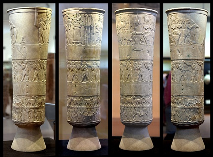 The votive Warka Vase within its display case at the Sumerian Gallery of the Iraq Museum. It is about 1 meter tall.