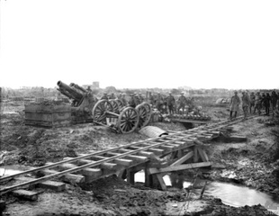 BL 9.2 inch Howitzer with shells lined up on the ground recently delivered from the trench railway in the foreground.