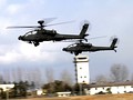 AH-64D Apache Longbow helicopters flying at Camp Humphreys in February 2004.