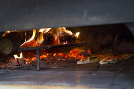 Pide baking in wood fired oven in Istanbul