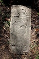 Tombstone with individual holding a duck