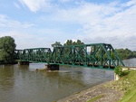 Side view of the iron truss railway bridge over Mura River in Mursko Središće, Croatia