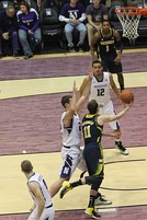 Stauskas in action in the 2012–13 Big Ten Conference men's basketball season opener on January 3 against Northwestern: left—slashing, left center—a layup, right center—follow through on a three-point field goal, right— a jump shot